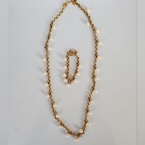 Long pearl necklace with matching bracelet